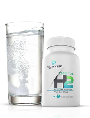 Essential H2 hydrogen water tablets with magnesium, bottle and glass of water